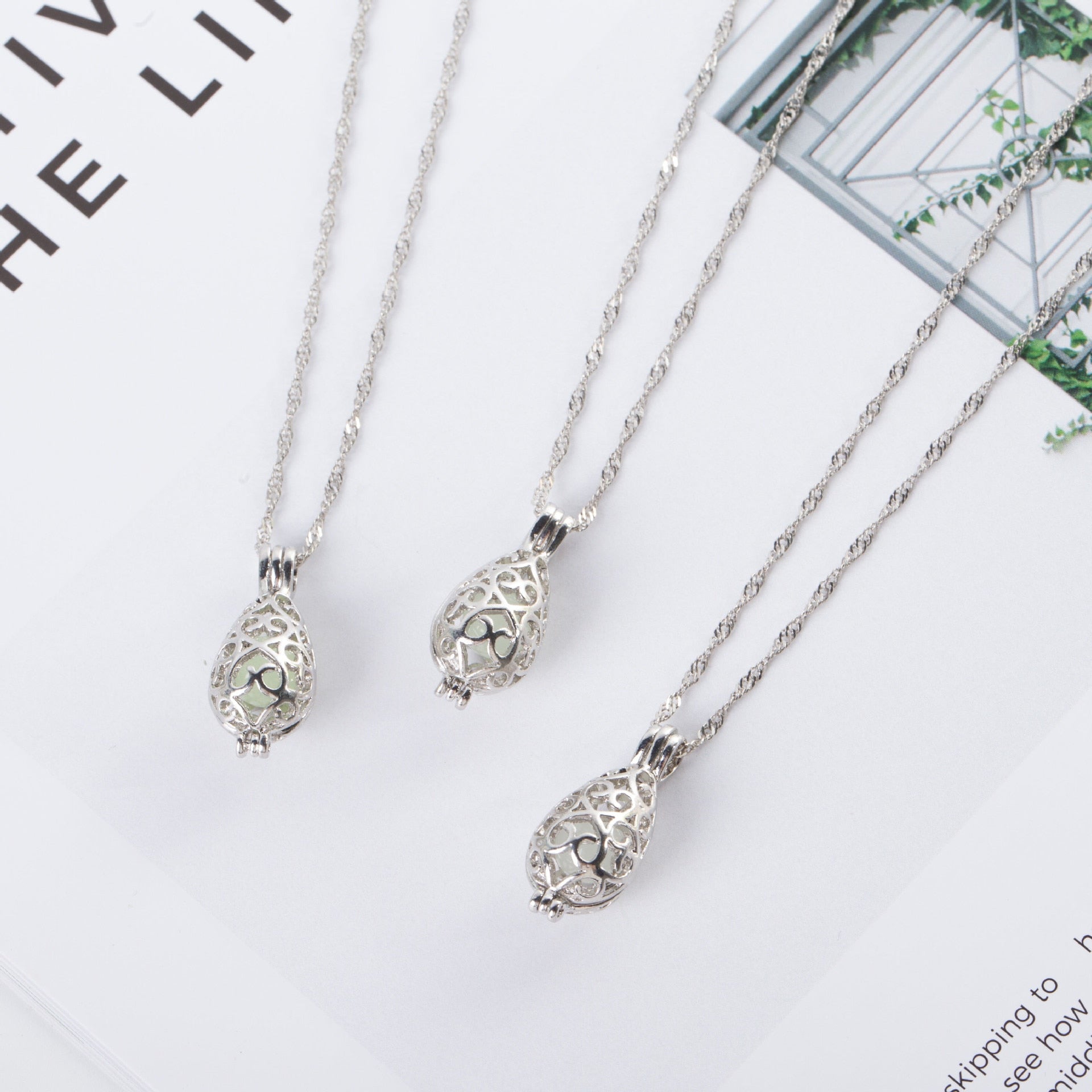 Special creative water drop luminous necklace can open hollow luminous necklace, women's simple small cage clavicle chain